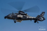 我国自主研制出口型武装直升机直-19E在哈尔滨成功首飞 - 人民网