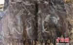 甘肃黑山岩画是中国北方岩画的典型代表，画面内容丰富多彩，主要有动物、人物、植物、舞蹈、狩猎、佛殿等，形象生动。　丁思 摄 - 甘肃新闻