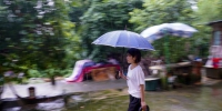 （图片故事）（1）重庆永川：雨中逆行者 守护百姓安全的地质灾害监测员 - 人民网