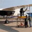 图为国家增雨飞机新舟60(B-651N)在洛阳机场开展机载设备维护及任务系统升级工作。　甘肃省气象局供图 - 甘肃新闻